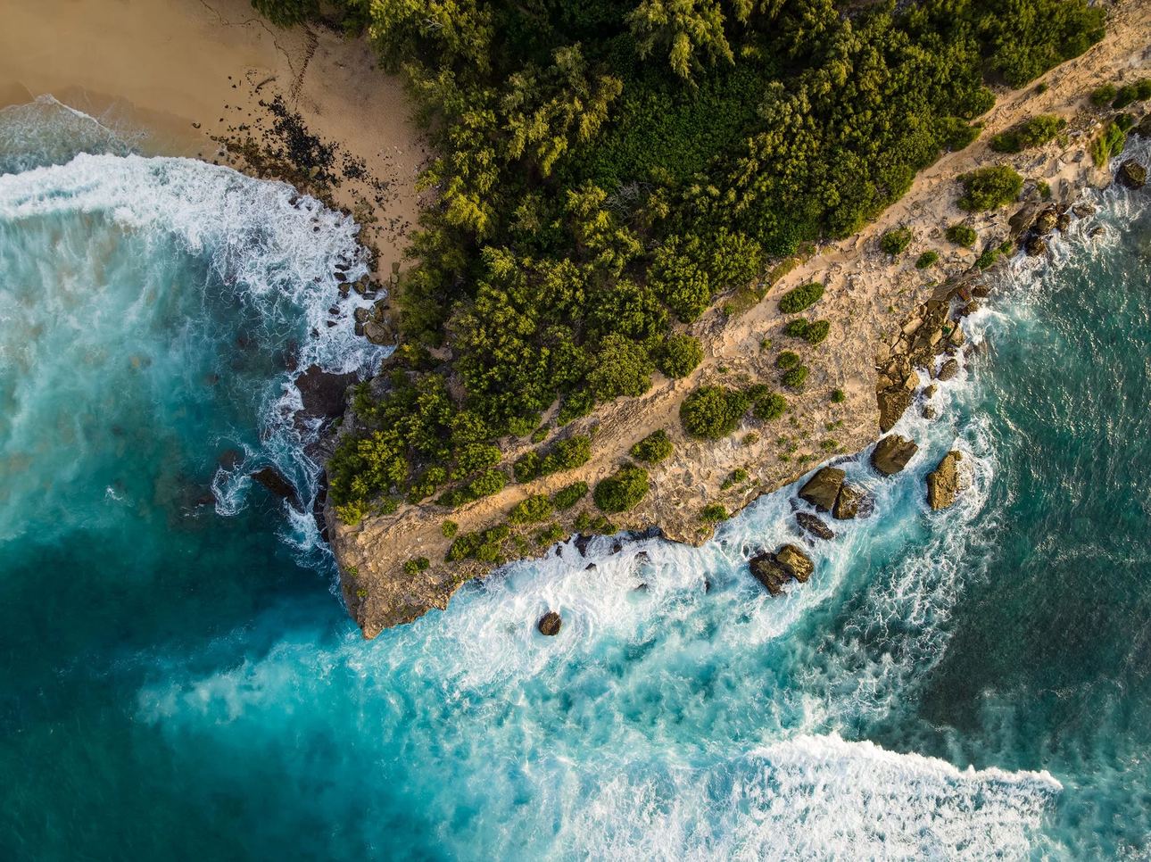 Aerial coastal landscape of Kauai, Hawaii with tropical greenery and golden shoreline, fine art photography print by Clint Losee