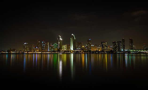 The downtown San Diego city skyline lights up the bay at night.  Viewed from Coronado. (Clint Losee)